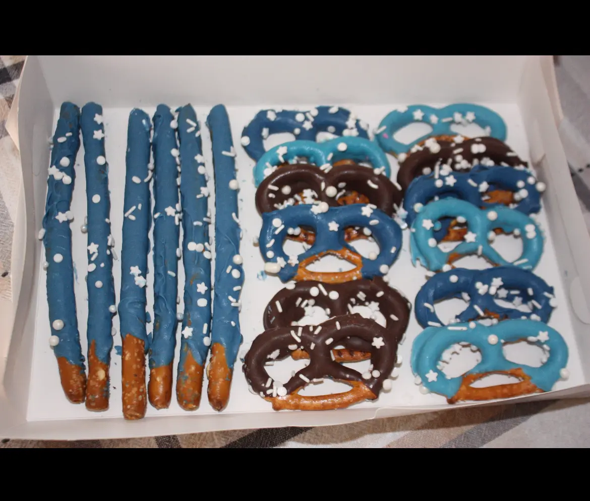 Winter box of blue pretzel rods and chocolate-dipped pretzels with snowflake sprinkles