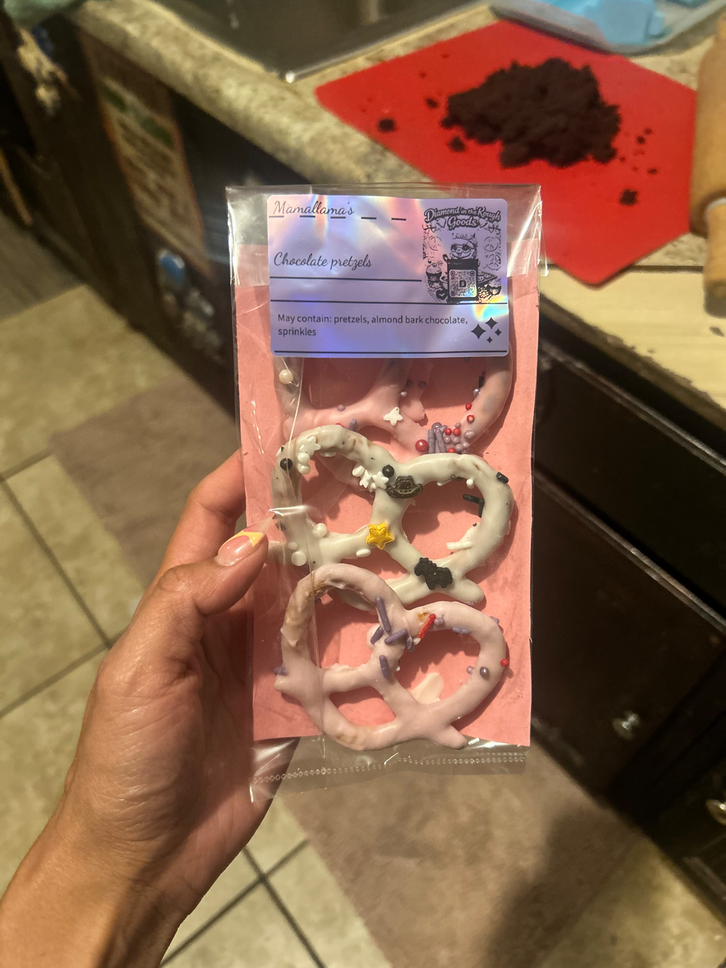 Packaged chocolate pretzels with Mamalllama's label
