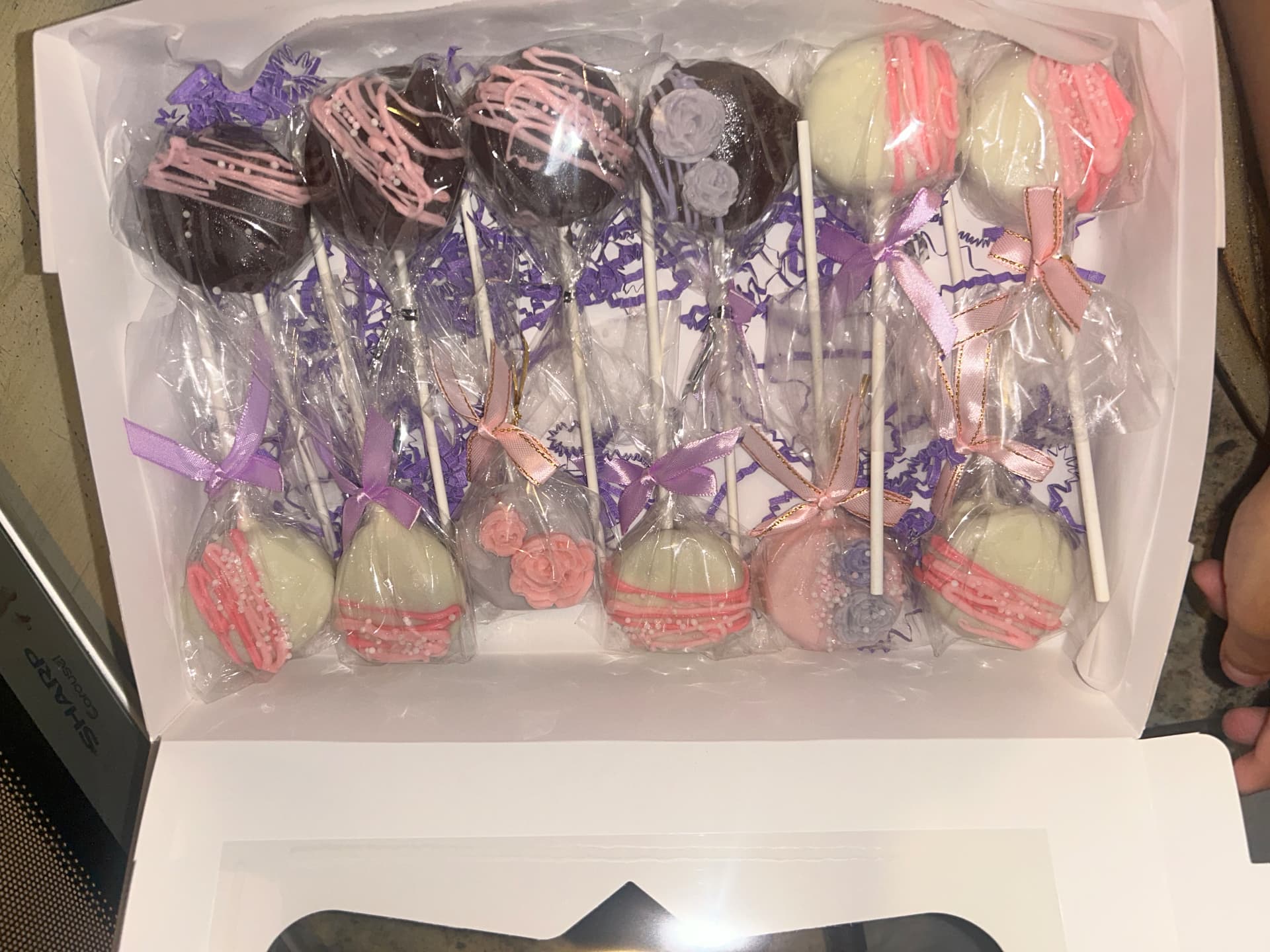 Cake pops with sprinkles in a glass jar
